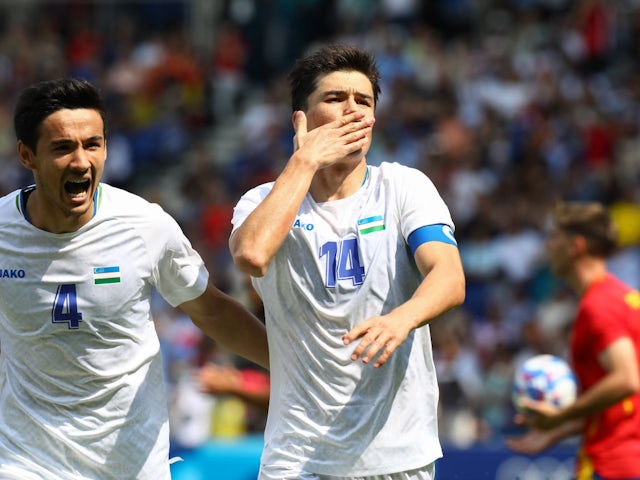 Uzbekistan's Eldor Shomurodov celebrates after scoring at the Olympics on July 27, 2024