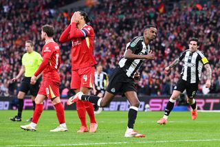 Alexander Isak of Newcastle United celebrates scoring his team's second goal as Virgil van Dijk of Liverpool looks dejected during the Carabao Cup Final between Liverpool and Newcastle United at Wembley Stadium on March 16, 2025 in London, England.