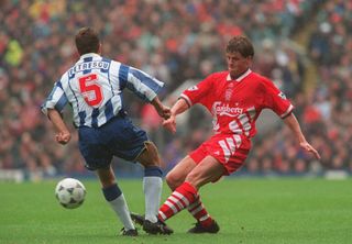 Liverpool's Stig Inge Bjornebye is challenged by Sheffield Wednesday's Dan Petrescu during a game in October 1994.