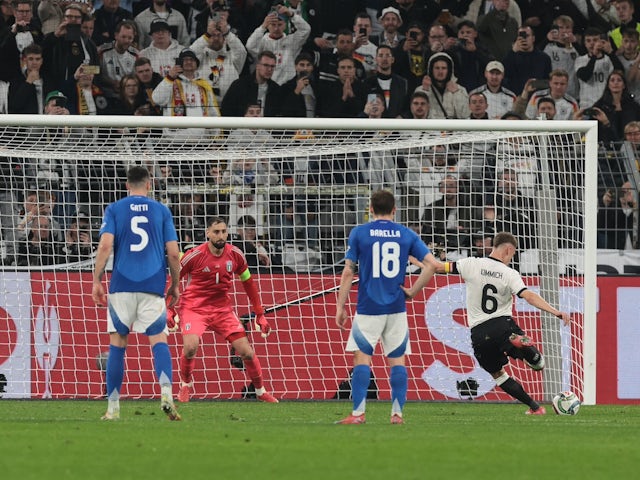 Joshua Kimmich of Germany makes it 1-0 against goalkeeper Gianluigi Donnarumma of Italy from the penalty spot on March 23, 2025