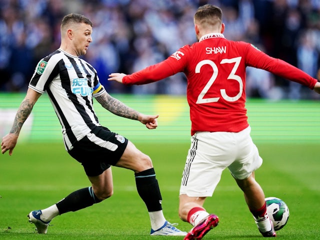 Newcastle United's Kieran Trippier and Manchester United's Luke Shaw battle for possession on February 26, 2023