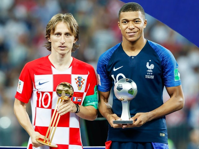 Croatia's Luka Modric and France's Kylian Mbappe on July 15, 2018