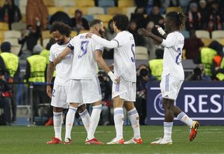 Karim Benzema celebrates with his team-mates after scoring for Real Madrid against Shakhtar Donetsk in the Champions League in October 2021.