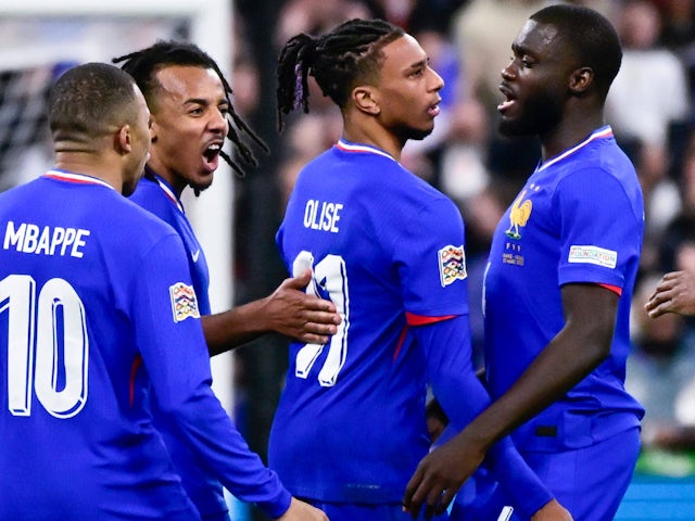 France's Michael Olise, Dayot Upamecano and Jules Kounde celebrate on March 23, 2025