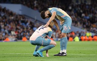 Josko Gvardiol of Manchester City checks on Kevin De Bruyne who is injured during the UEFA Champions League 2024/25 League Phase MD1 match between Manchester City and FC Internazionale Milano at Etihad Stadium on September 18, 2024 in Manchester, England.