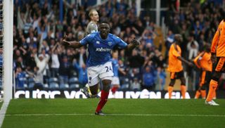 Aruna Dindane celebrates after scoring for Portsmouth against Wigan Athletic in October 2009.