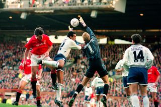 Tottenham goalkeeper Erik Thorstvedt jumps to catch a ball in a game against Manchester United in October 1993.