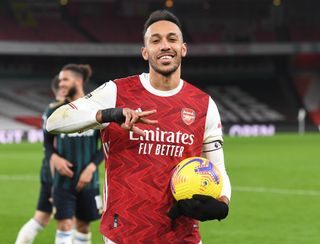 Pierre-Emerick Aubameyang poses with the match ball after scoring a hat-trick for Arsenal against Leeds United in February 2021.