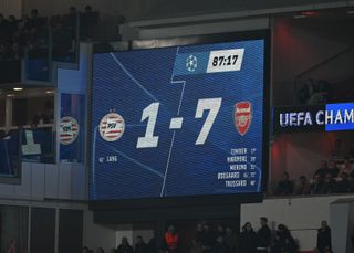 The scoreboard in Eindhoven shows Arsenal's amazing 7-1 scoreline against PSV in the Champions League in March 2025.