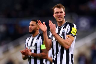 Dan Burn of Newcastle United applauds the supporters at full-time following the UEFA Champions League match between Newcastle United FC and AC Milan at St. James Park on December 13, 2023 in Newcastle upon Tyne, England. (Photo by Chris Brunskill/Fantasista/Getty Images)