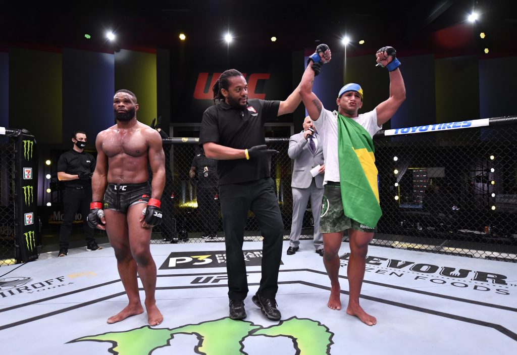 Gilbert Burns celebrates his win over Tyron Woodley