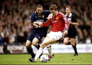 Jesper Blomqvist in action for Manchester United against Wimbledon in April 1999.