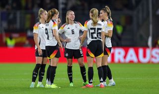 German players in a huddle