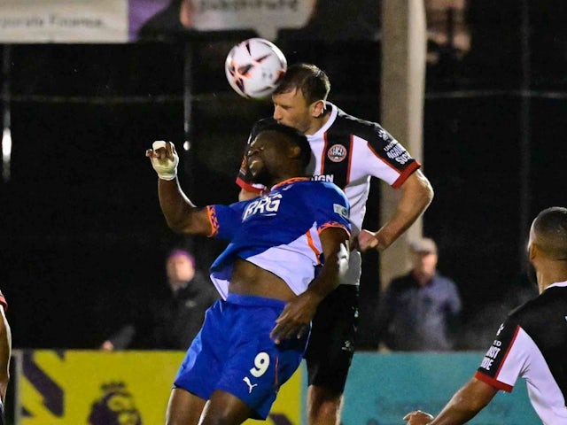 William De Havilland of Maidenhead United and Mike Fondop of Oldham Athletic challenge for the ball on October 22, 2024