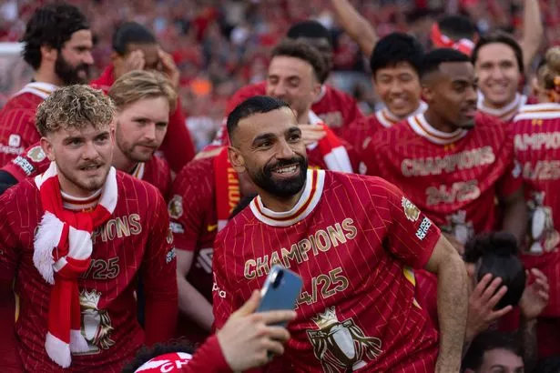 Liverpool's Mohamed Salah and the players celebrate winning the league after the Premier League match between Liverpool and Tottenham Hotspur at Anfield in Liverpool, England, on April 27, 2025. (Photo by Steven Halliwell | MI News/NurPhoto via Getty Images)