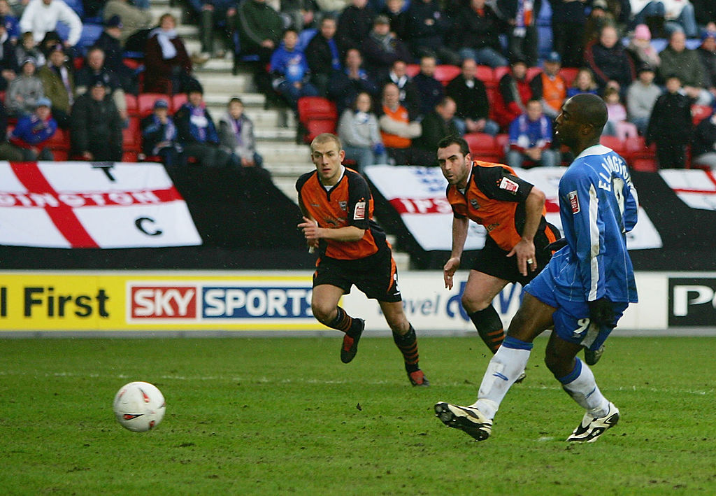 WIGAN, ENGLAND - MAY 8: Wigan celebrate going up to the Premiership during the Coca-Cola Championship match between Wigan Athletic and Reading at the JJB Stadium on May 8, 2005 in Wigan, England. (Photo by Matthew Lewis/Getty Images)