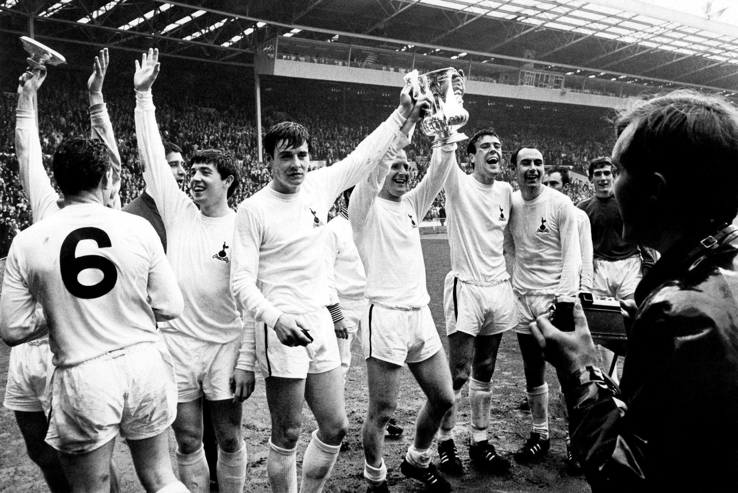 Tottenham players celebrate with the FA Cup after a 2-1 win over Chelsea at Wembley in the 1967 final.