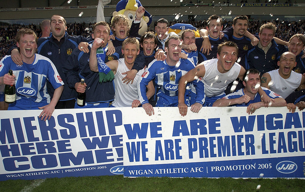 WIGAN, ENGLAND - MAY 8: Wigan celebrate going up to the Premiership during the Coca-Cola Championship match between Wigan Athletic and Reading at the JJB Stadium on May 8, 2005 in Wigan, England. (Photo by Matthew Lewis/Getty Images)