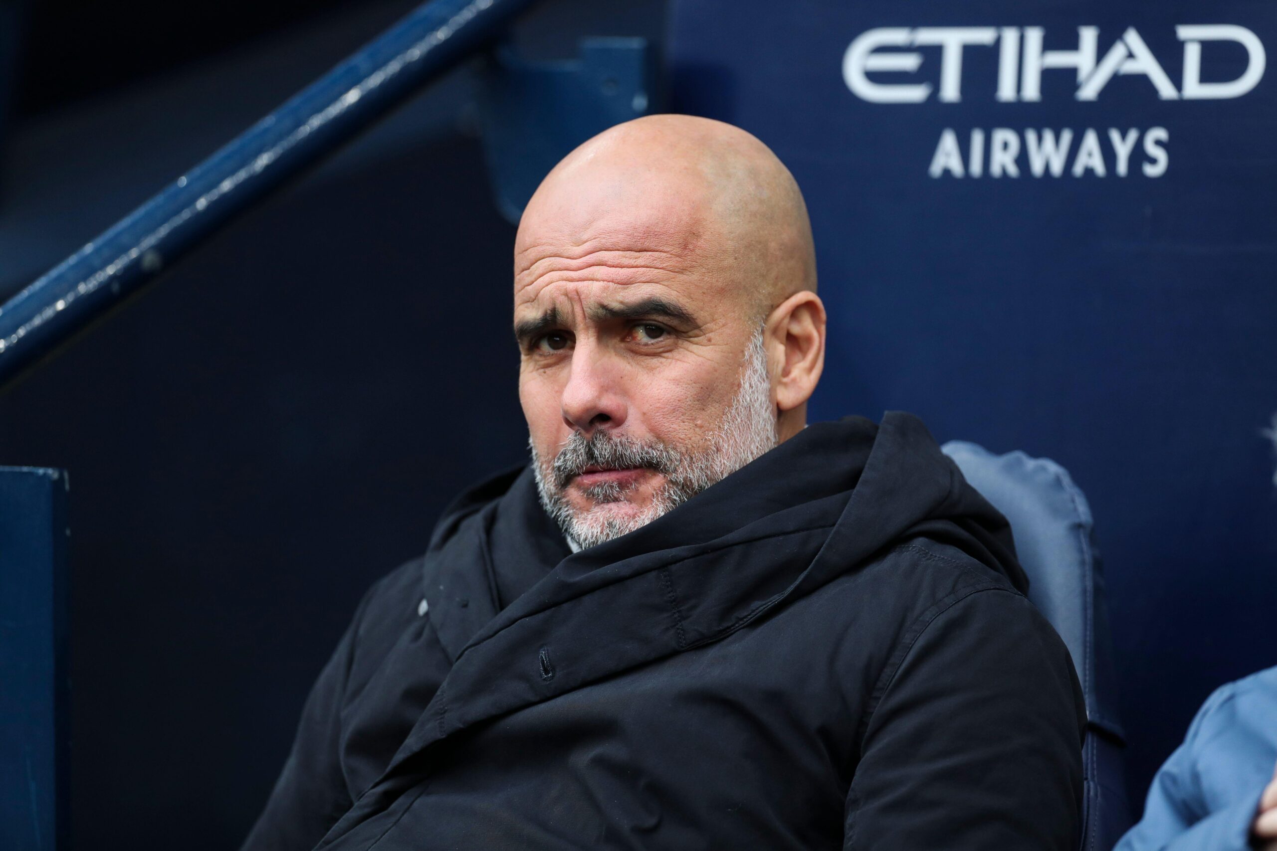 Manchester City manager Pep Guardiola looks on during the Premier League match against Brighton & Hove Albion at the Etihad Stadium in Manchester, UK on 15 March, 2025.