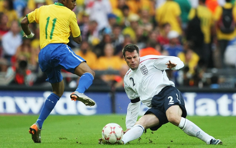 LONDON - JUNE 01: Jamie Carragher of England tackles Robinho of Brazil during the International Friendly match between England and Brazil at Wembley Stadium on June 1, 2007 in London, England. (Photo by Clive Mason/Getty Images)