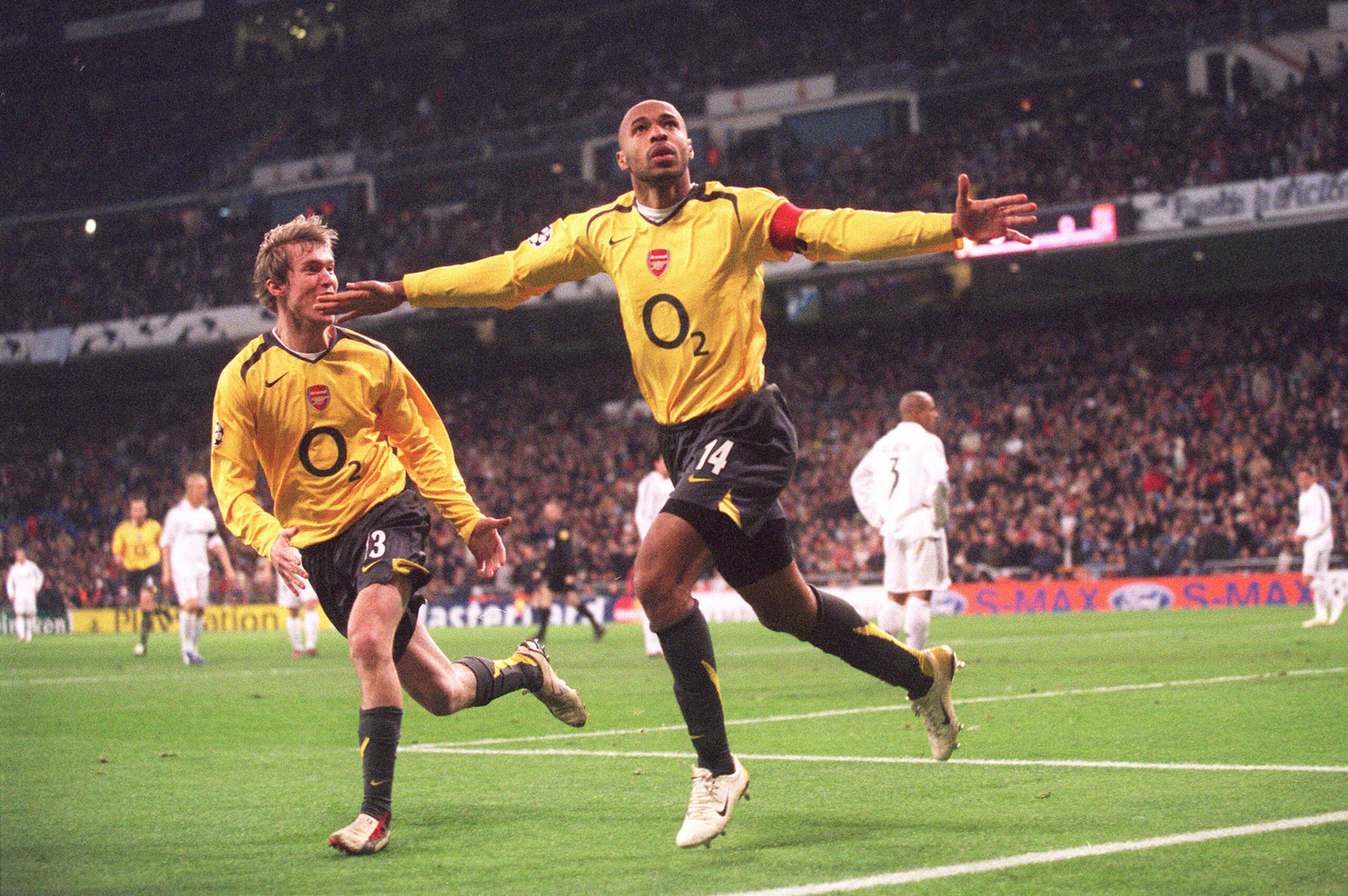 Thierry Henry celebrates with Alex Hleb after scoring for Arsenal against Real Madrid in the Champions League in February 2006.