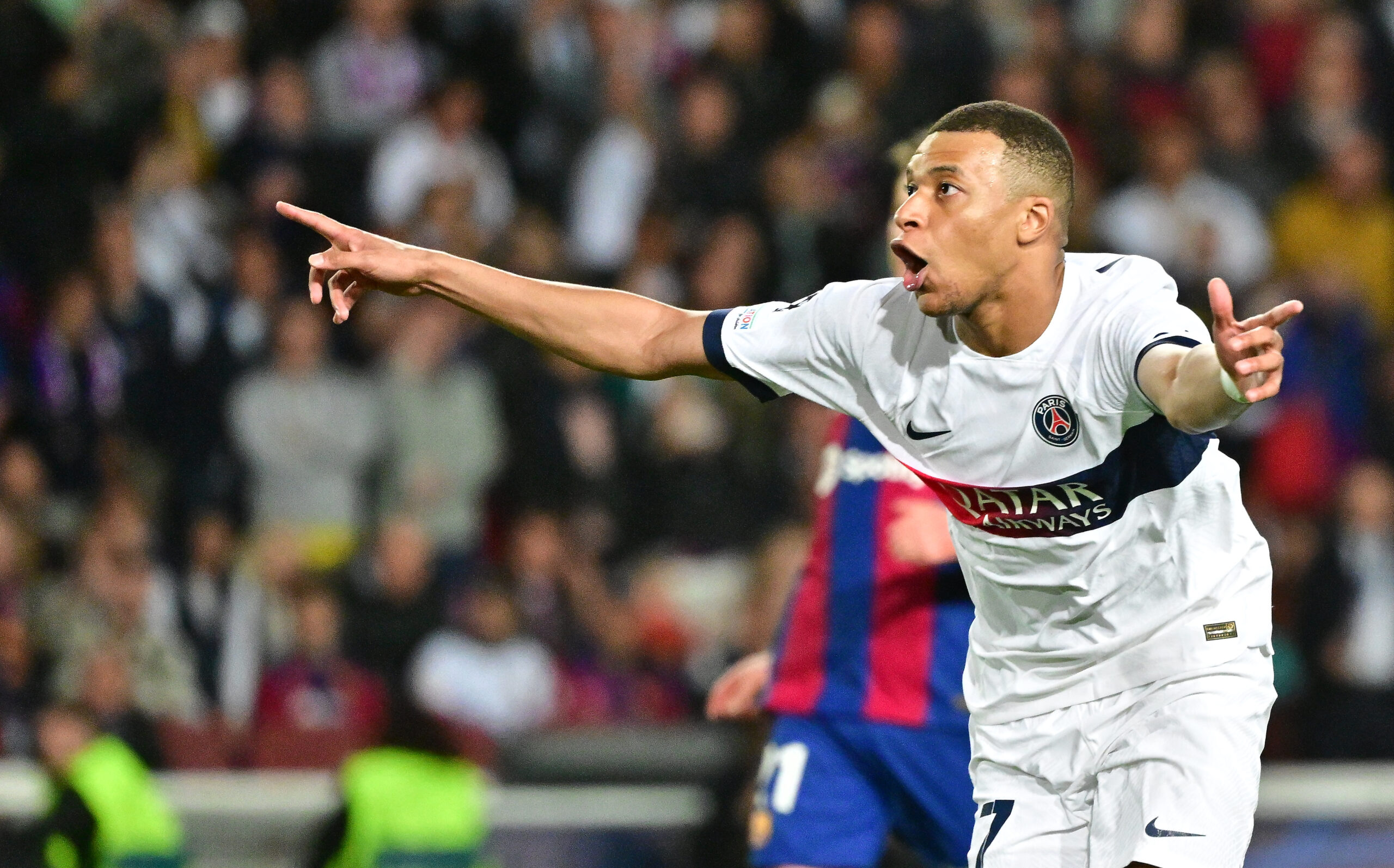 Kylian Mbappe celebrates after scoring for Paris Saint-Germain against Barcelona in the Champions League in April 2024.
