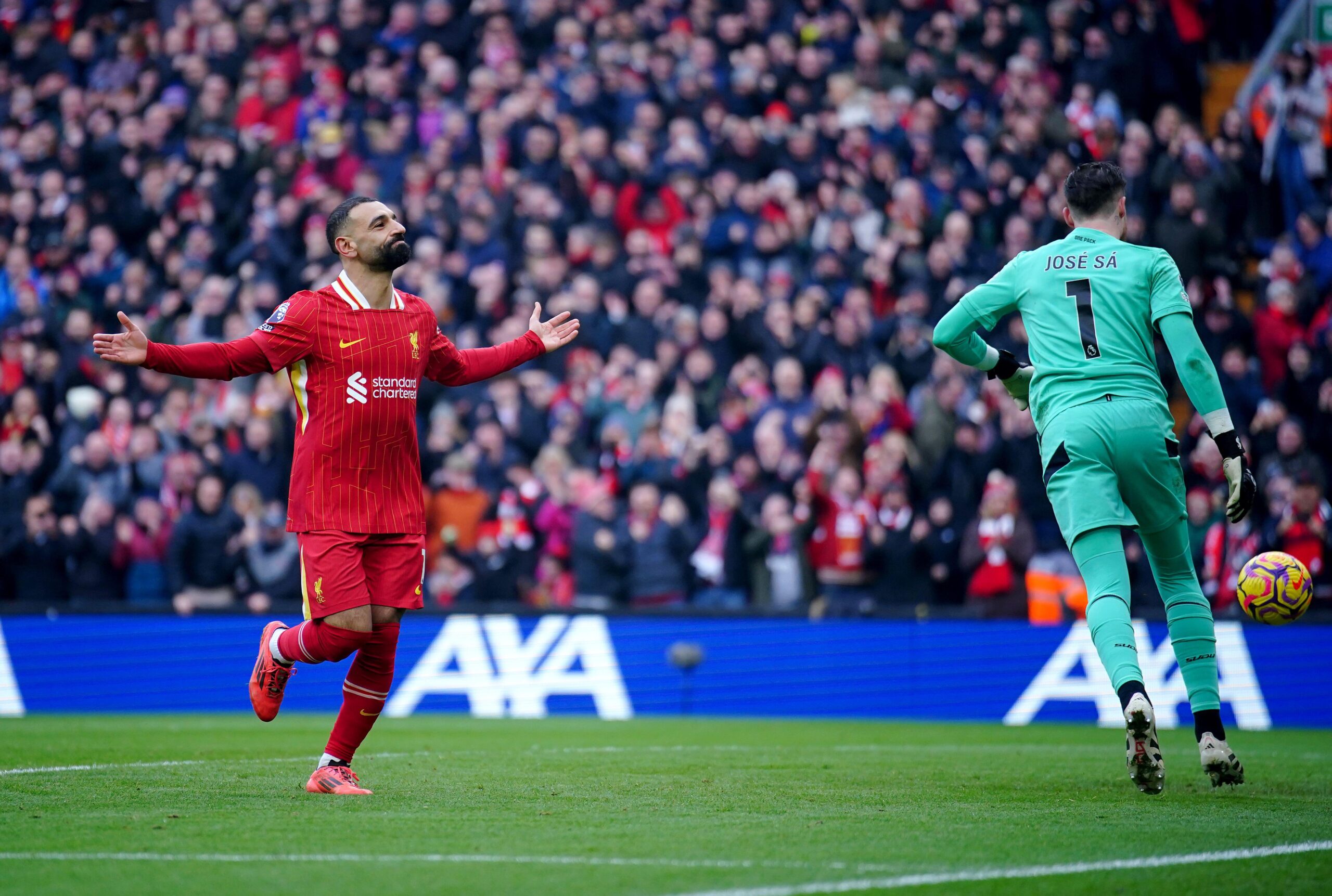 Mohamed Salah celebrates after scoring for Liverpool during the Premier League match against Wolverhampton Wanderers at Anfield in Liverpool, England on 16 February, 2025.