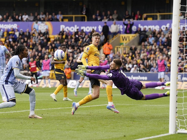Guglielmo Vicario of Tottenham Hotspur pushes the ball onto Djed Spence, leading to an own goal on April 13, 2025