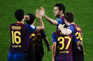 Barcelona players celebrate a goal in their 9-0 win over L'Hospitalet in the Copa del Rey in December 2011.