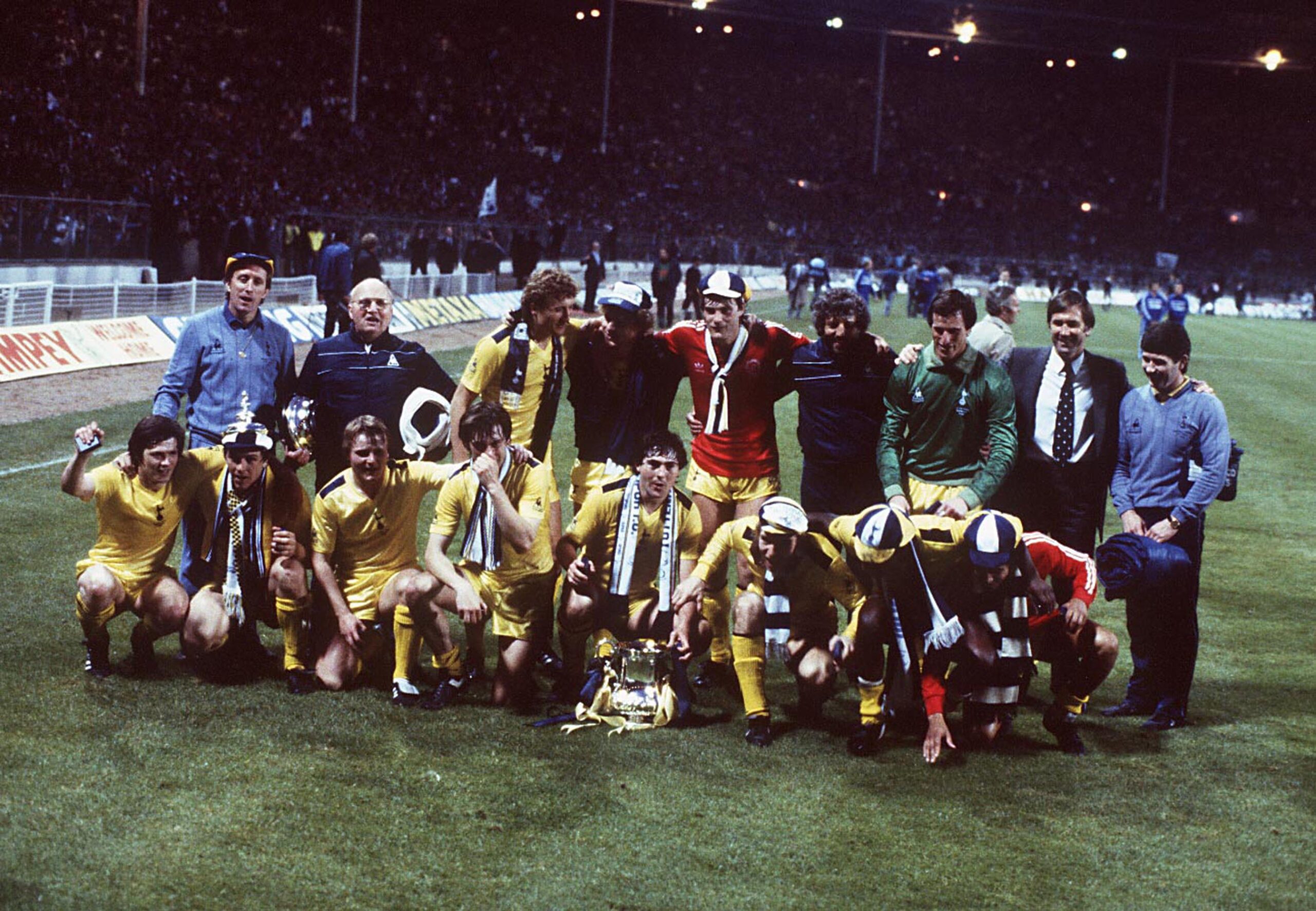 Tottenham players celebrate with the FA Cup after victory over QPR in the 1982 final at Wembley.