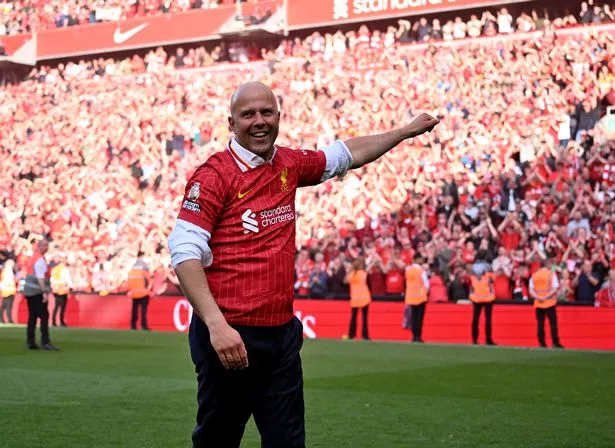 Arne Slot celebrates after Liverpool's Premier League title is confirmed