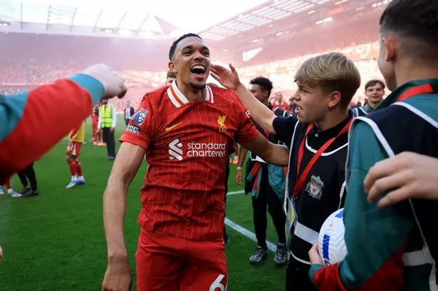 Trent Alexander-Arnold celebrates Liverpool's Premier League title victory