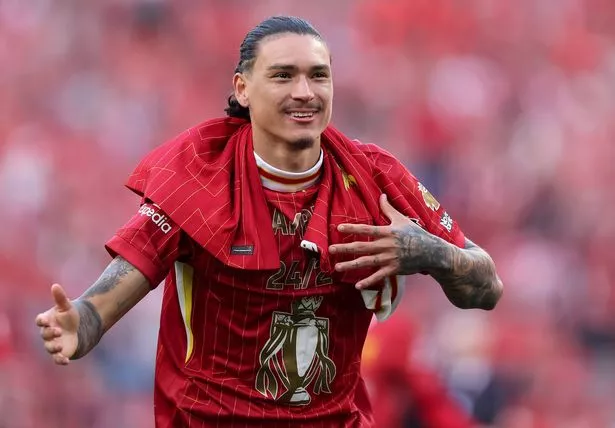 LIVERPOOL, ENGLAND - APRIL 27: Darwin Nunez of Liverpool celebrates the teams victory and confirmation of winning the Premier League title after the Premier League match between Liverpool FC and Tottenham Hotspur FC at Anfield on April 27, 2025 in Liverpool, England. (Photo by Carl Recine/Getty Images)