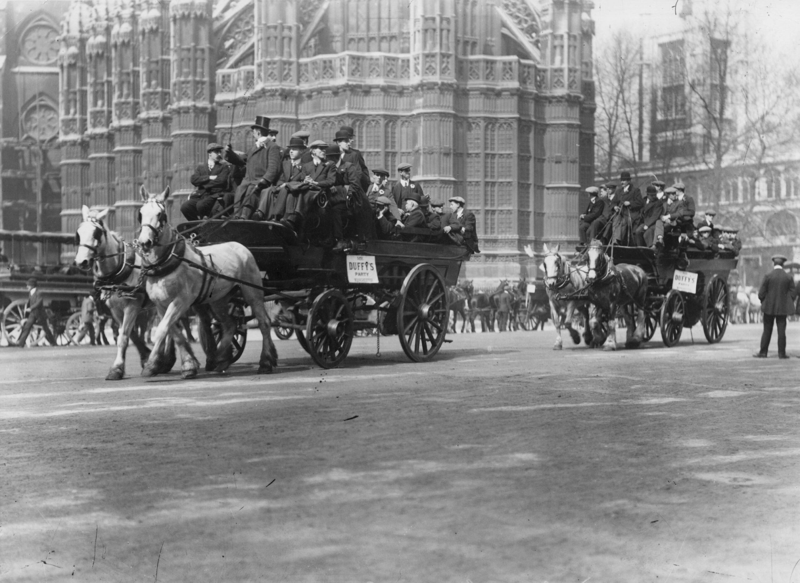 Football supporters head to the 1912 FA Cup final between Barnsley and West Brom on horse-drawn buses.