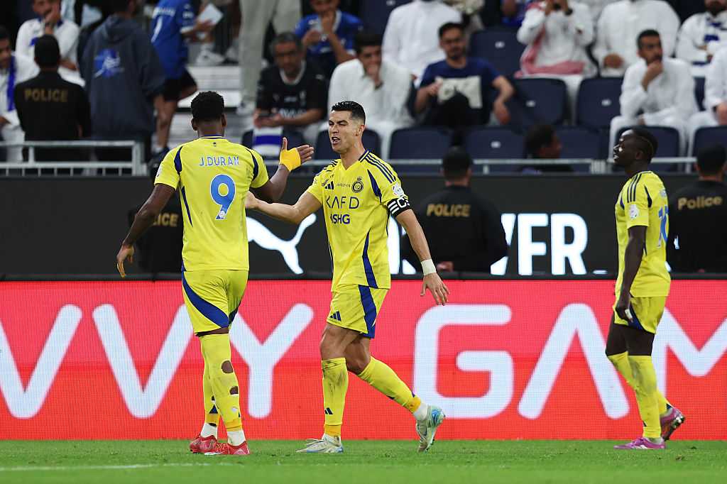 RIYADH, SAUDI ARABIA - APRIL 04: Cristiano Ronaldo of Al Nassr celebrates scoring his team's third goal with teammate Jhon Duran during the Saudi Pro League match between Al Hilal v Al Nassr in the Kingdom Arena on April 04, 2025 in Riyadh, Saudi Arabia. (Photo by Yasser Bakhsh/Getty Images)