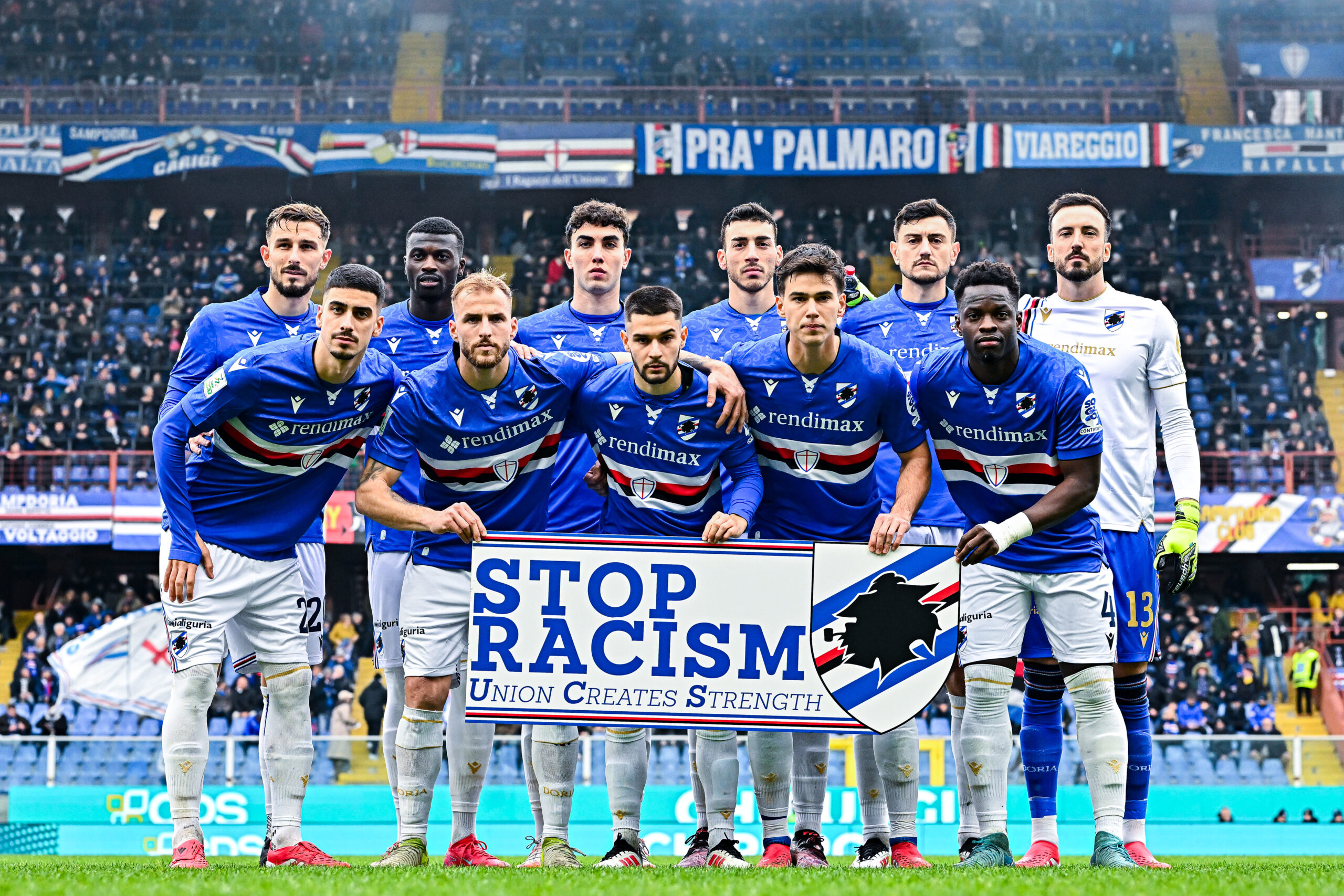 Sampdoria's 2025/26 team hold a 'Stop Racism' sign before kick off