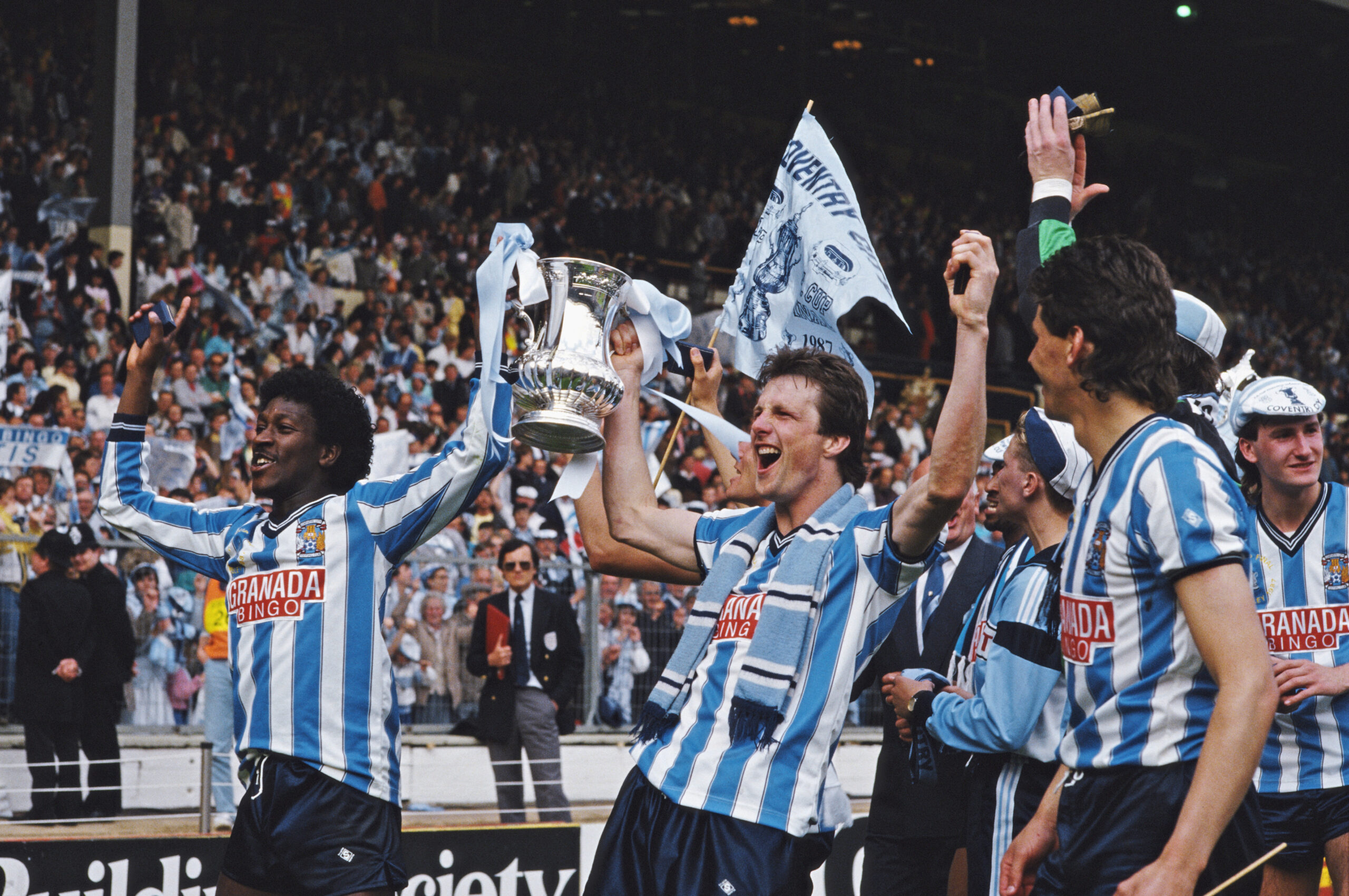 Coventry City players celebrate with the trophy after victory over Tottenham Hotspur in the 1987 FA Cup final at Wembley.