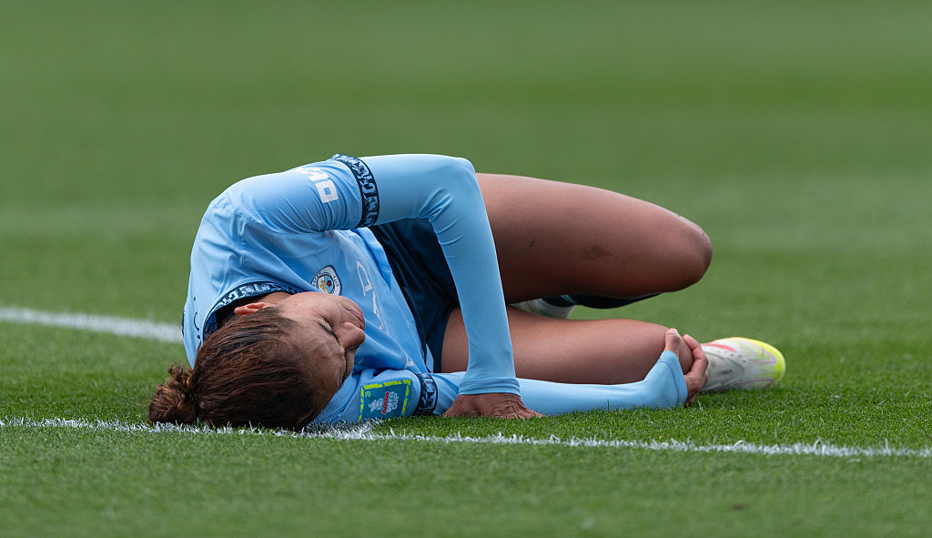 Mary Fowler on the floor after sustaining an ACL injury