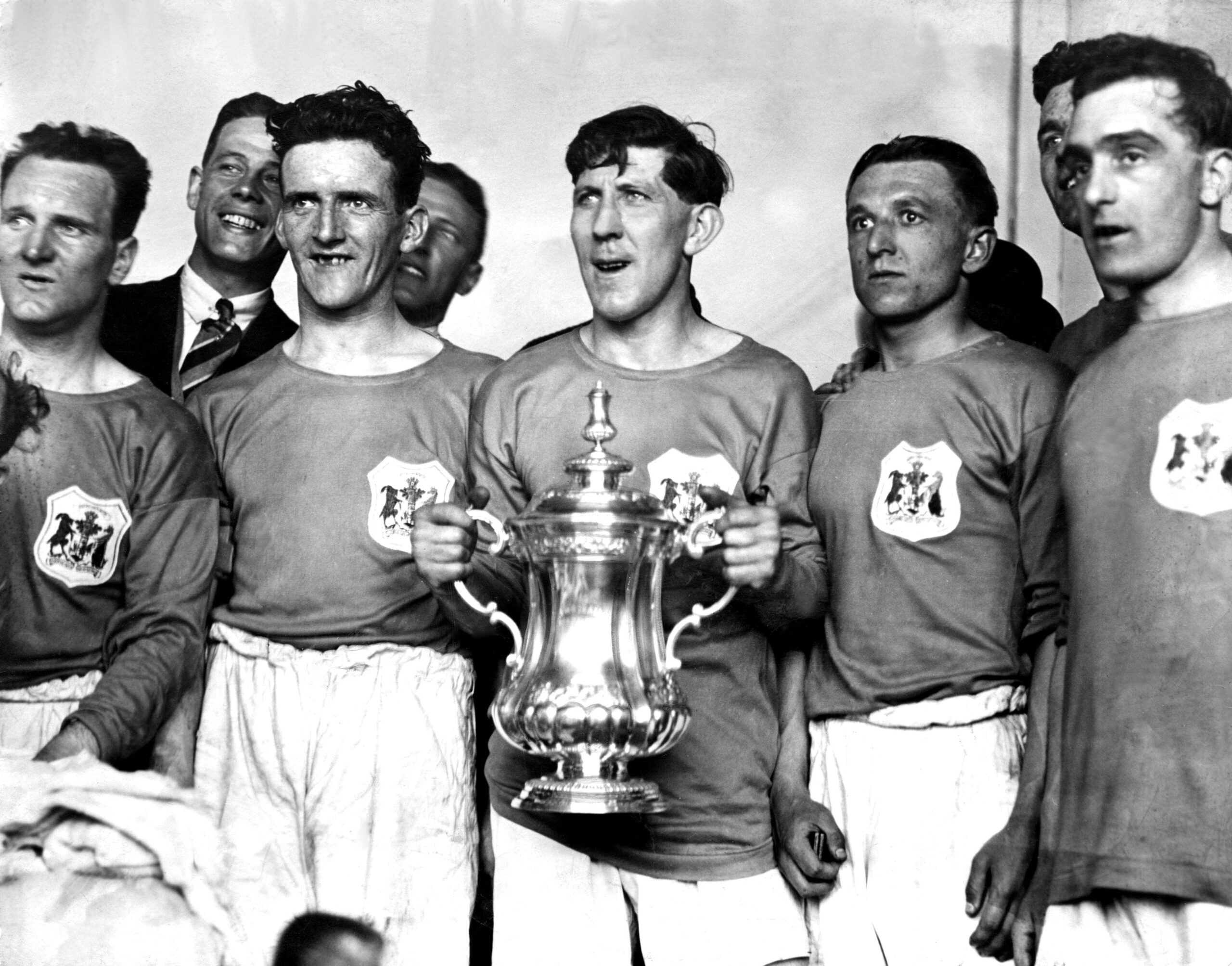 Cardiff City players pose with the FA Cup after victory over Arsenal in the final in April 1927.