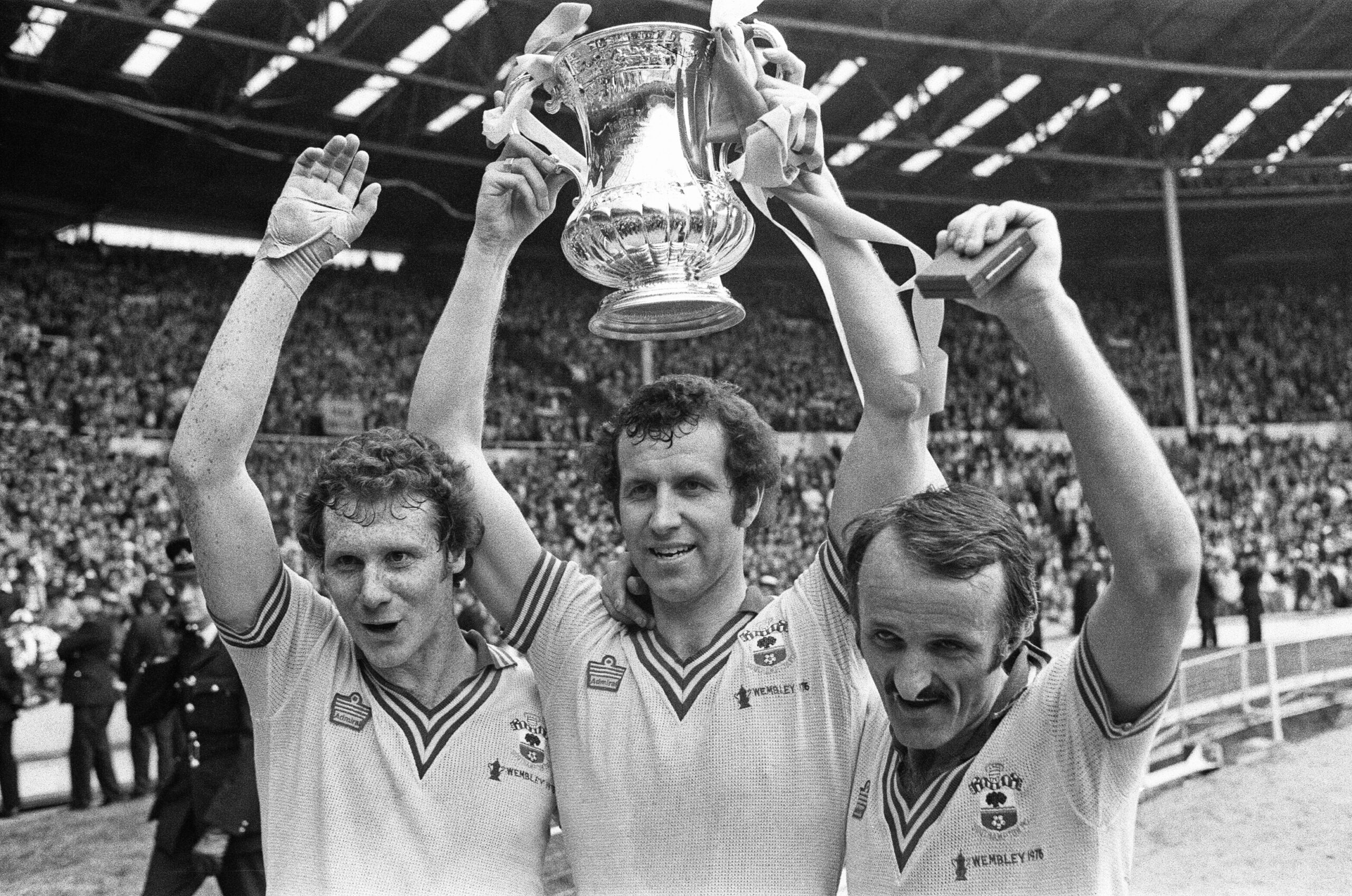 Southampton players celebrate with the trophy after their FA Cup final win over Manchester United in May 1976.