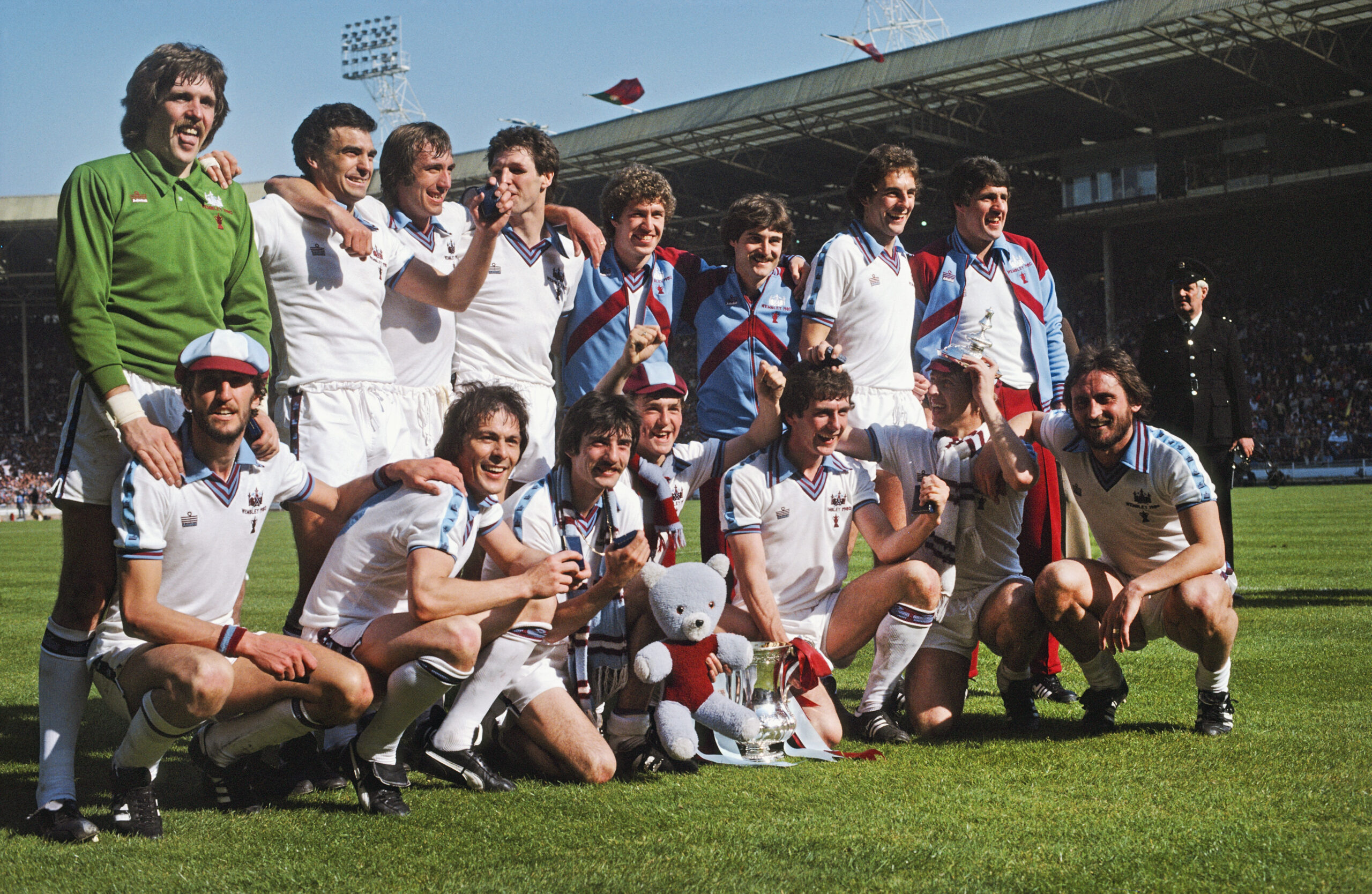 West Ham players pose with the FA Cup after victory in the final against Arsenal in May 1980.