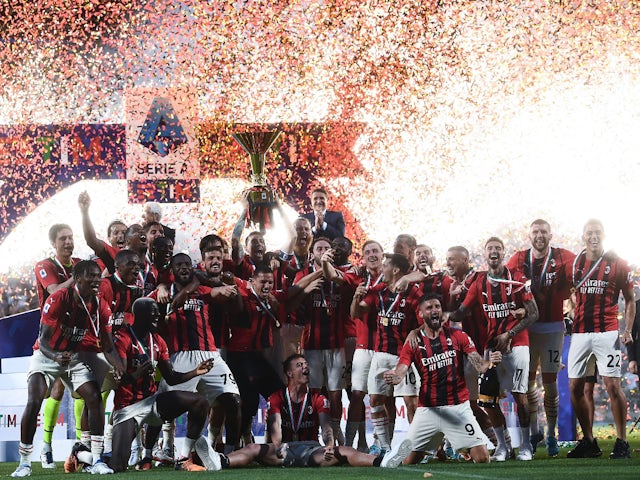AC Milan's players celebrate winning the Serie A title in 2022