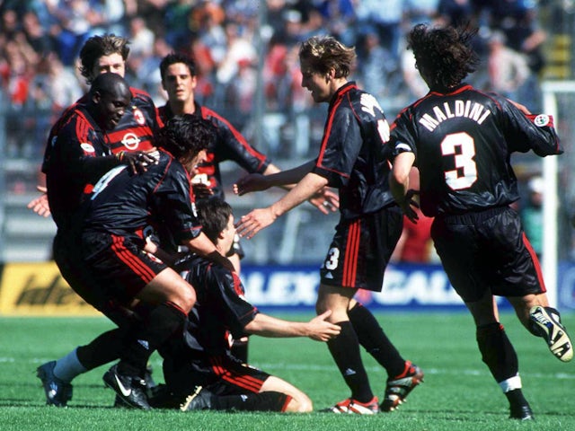 AC Milan players celebrate scoring against Perugia on the final day of the 1998-99 season