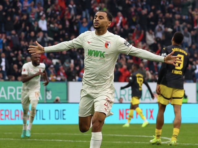 Alexis Claude-Maurice celebrates scoring for Augsburg on October 26, 2024