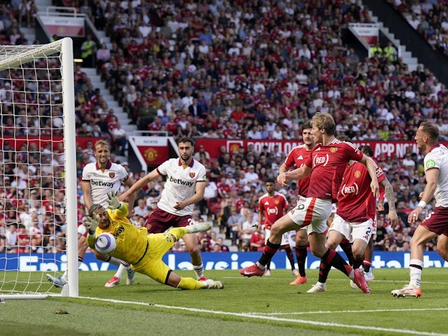 Alphonse Areola of West Ham United saves a shot from Manchester United's Rasmus Hojlund on May 11, 2025