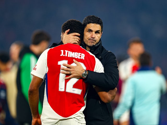 Arsenal manager Mikel Arteta looks on dejected with Jurrien Timber on May 7, 2025