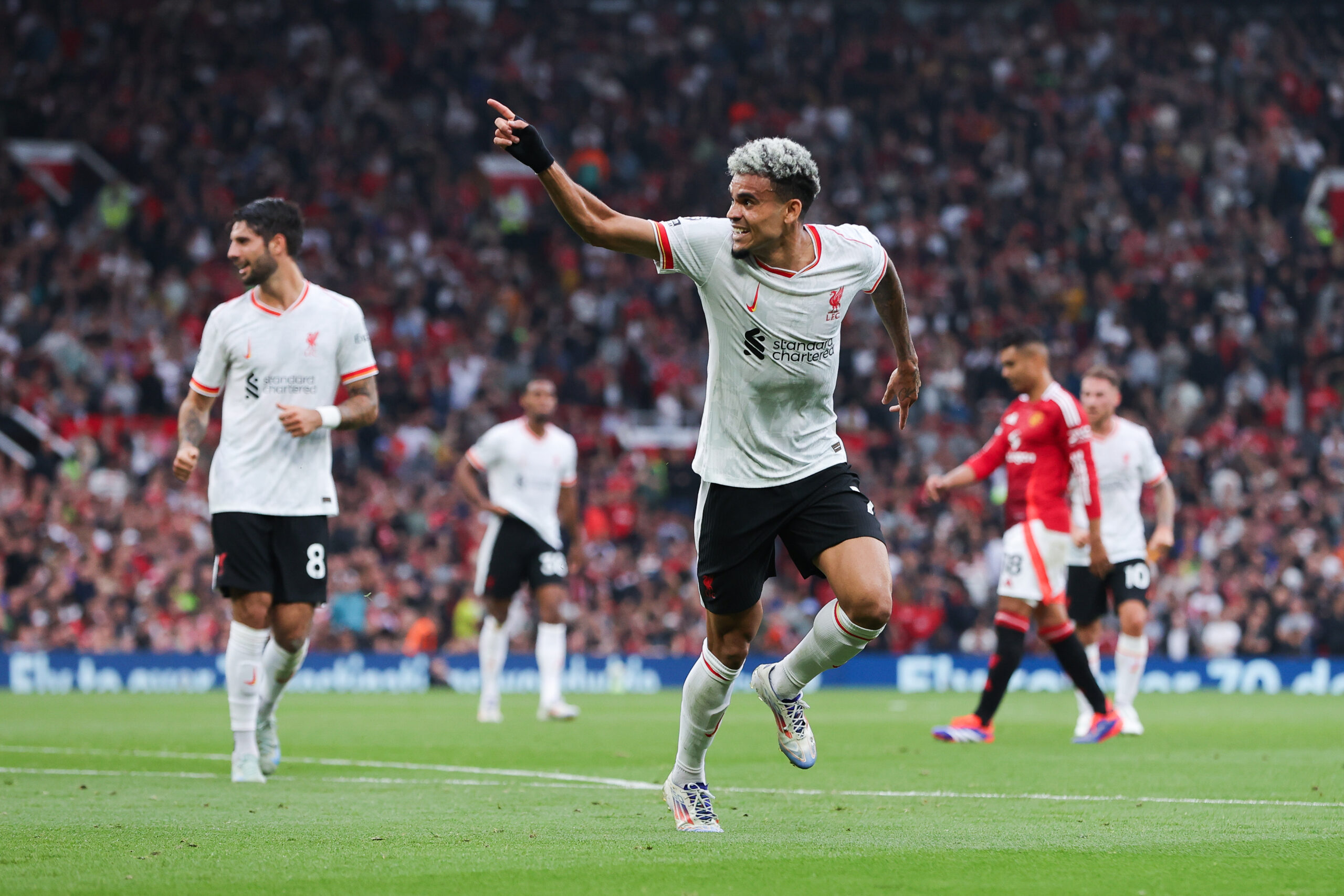 Luis Diaz celebrates after scoring his second goal for Liverpool against Manchester United in the Premier League at Old Trafford in September 2024.