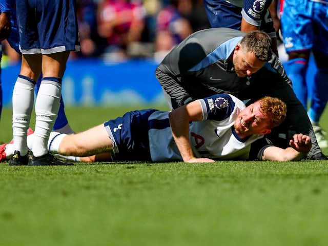 Tottenham Hotspur's Dejan Kulusevski receives treatment during his side's match against Crystal Palace, on May 11, 2025