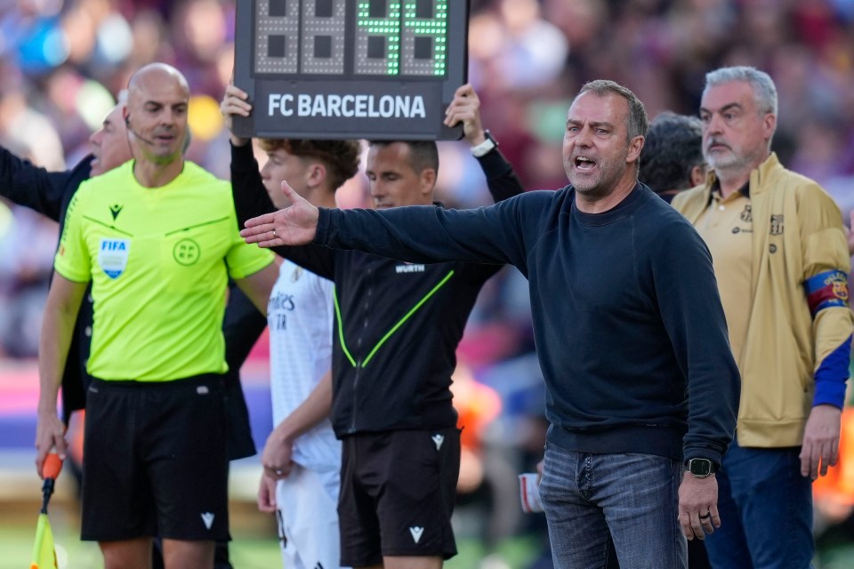 Hansi Flick, FC Barcelona's head coach, gestures during a soccer match.