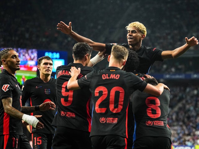 Barcelona players celebrate Lamine Yamal's goal against Espanyol on May 15, 2025